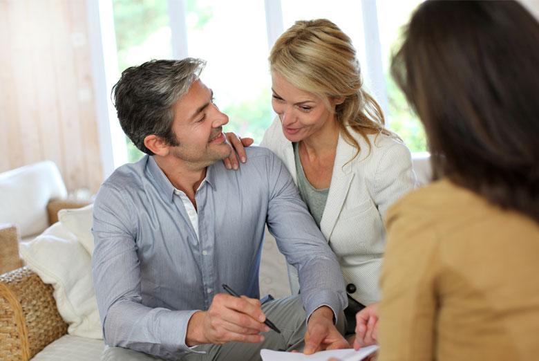 Middle-Aged Couple reviewing their financial plan in their living room